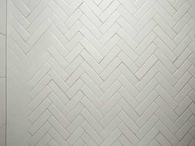 2 White Tiles Tiled With A Herringbone Pattern