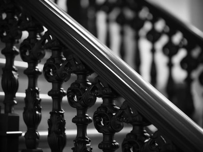 Black And White Photo With Carved Stair Rails