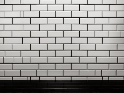 Black And White Tiled Wall Behind A Table