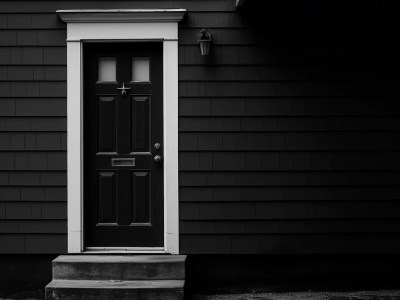 Black Door With White Steps Next To It