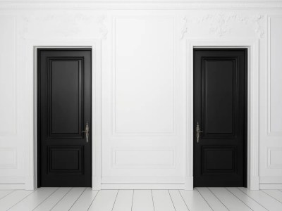 Black Doors Of Different Sizes In A Room Decorated With White Walls