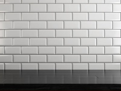 Dark Brown Tiled Countertop Sits Against A Clean White Tiled Wall