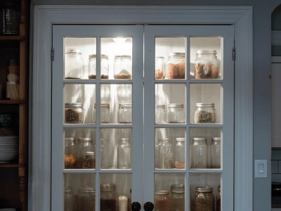 Glass Door With Jars Of Various Kinds Of Food