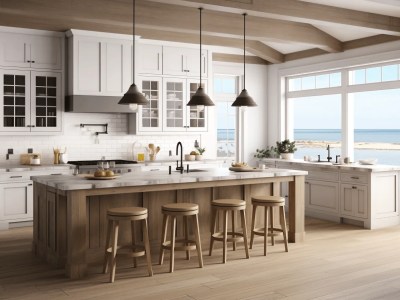 Kitchen With Cabinets And Islands With Stools Overlooking An Ocean