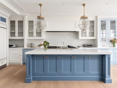 Painted Light Blue Cabinets With A Beige Island