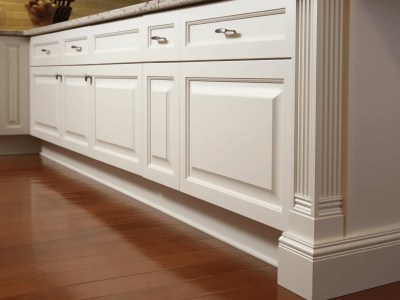 White Kitchen Cabinet With A Wooden Floor