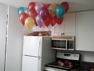 White Kitchen With A Few Balloons Hanging From The Ceiling