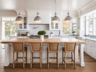 White Kitchen With Wooden Chairs And An Island