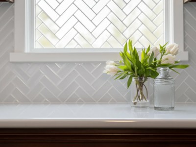 White Subway Tile With Flowers Above A Window