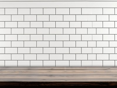 White Tile Wall Behind A Wooden Table